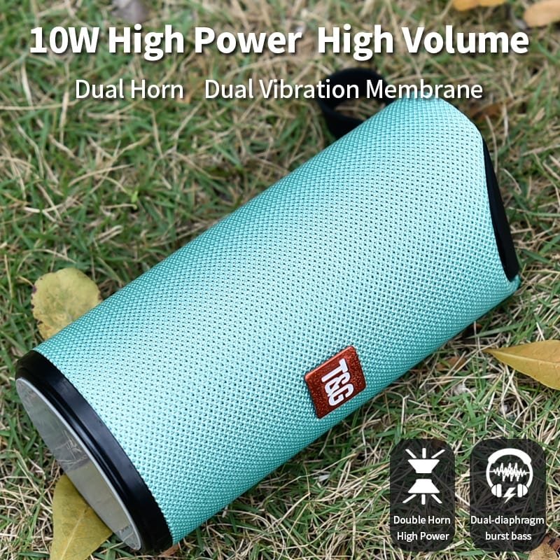 Teal Bluetooth speaker with TWS logo on grass