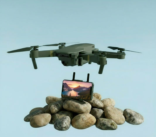 Black drone with folded wings, remote control, and smartphone displaying app interface on a white background